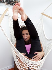 Hairy girl Lucie lounges in her hammock