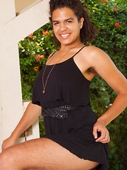Hairy Yonique showing off in a pretty black dress